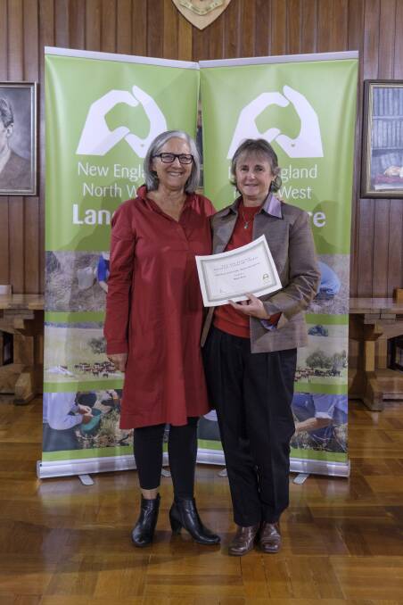 WORKING HARD: Mahri Koch receiving her award from Sally Wright at the Landcare awards dinner in Armidale earlier this month.