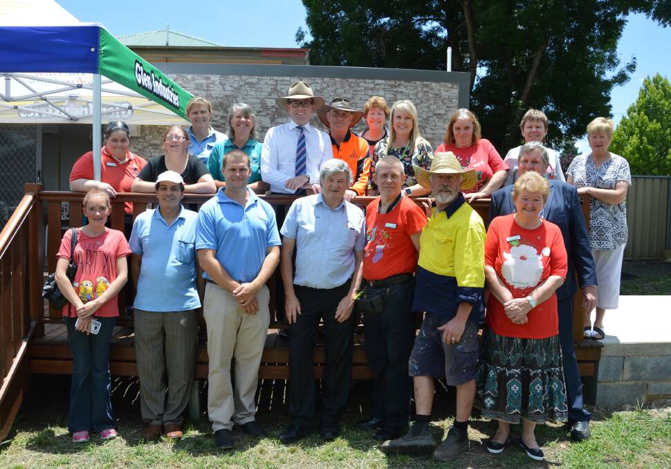 Cash injection: Northern Tablelands MP Adam Marshall and Glen Industries manager Kylie Hawkins with some of the Glen Industries employees who will benefit from a $17,748 grant to upgrade their community garden.