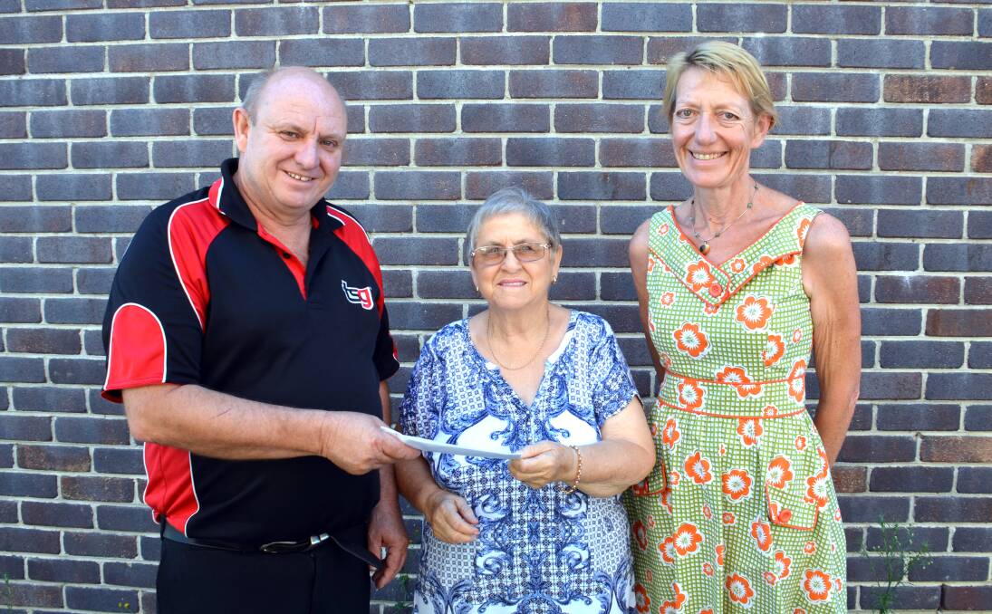 Good cause: TSG owner Peter Davis presents RSPCA volunteers Bev Pryor and Antonia Champion a cheque following the Christmas Santa Paws event in Glen Innes which raised vital funds for the local branch.