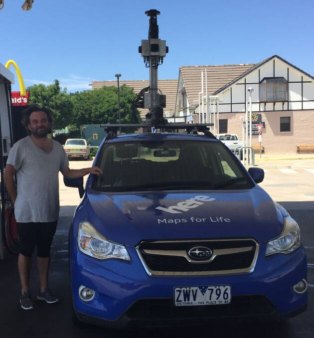 Spotted: Here maps is seen stopping for fuel in Glen Innes on Tuesday.