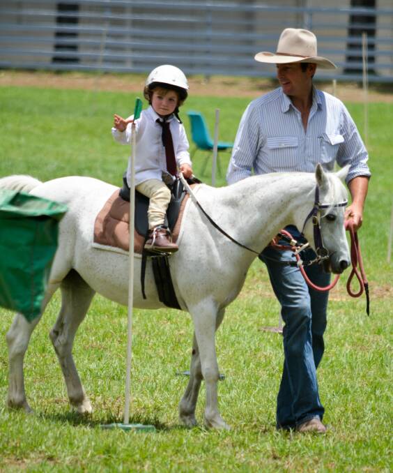 BACK IN THE SADDLE: Greg Wright and his two-year-old daughter Rose riding Lily at Pony Camp in January. Photo: Jane Alt.