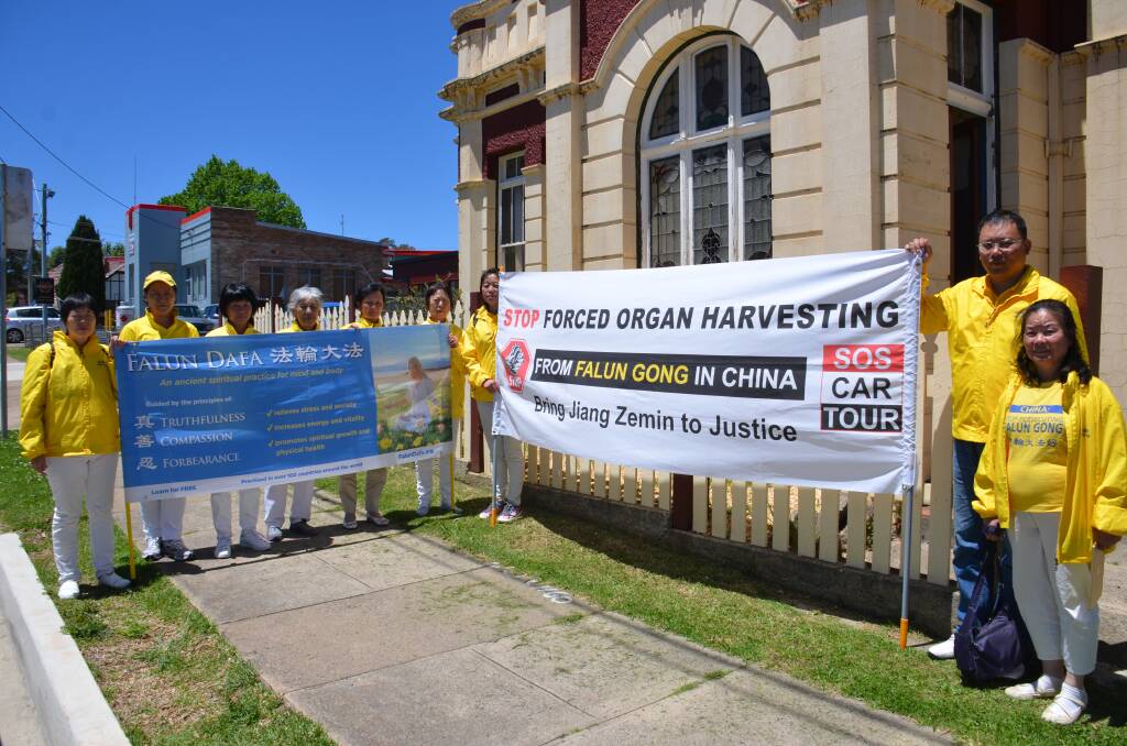 PROTEST:  Chinese spiritual mediation Falun Gong lined the streets of Glen Innes. Picture: Craig Thomson