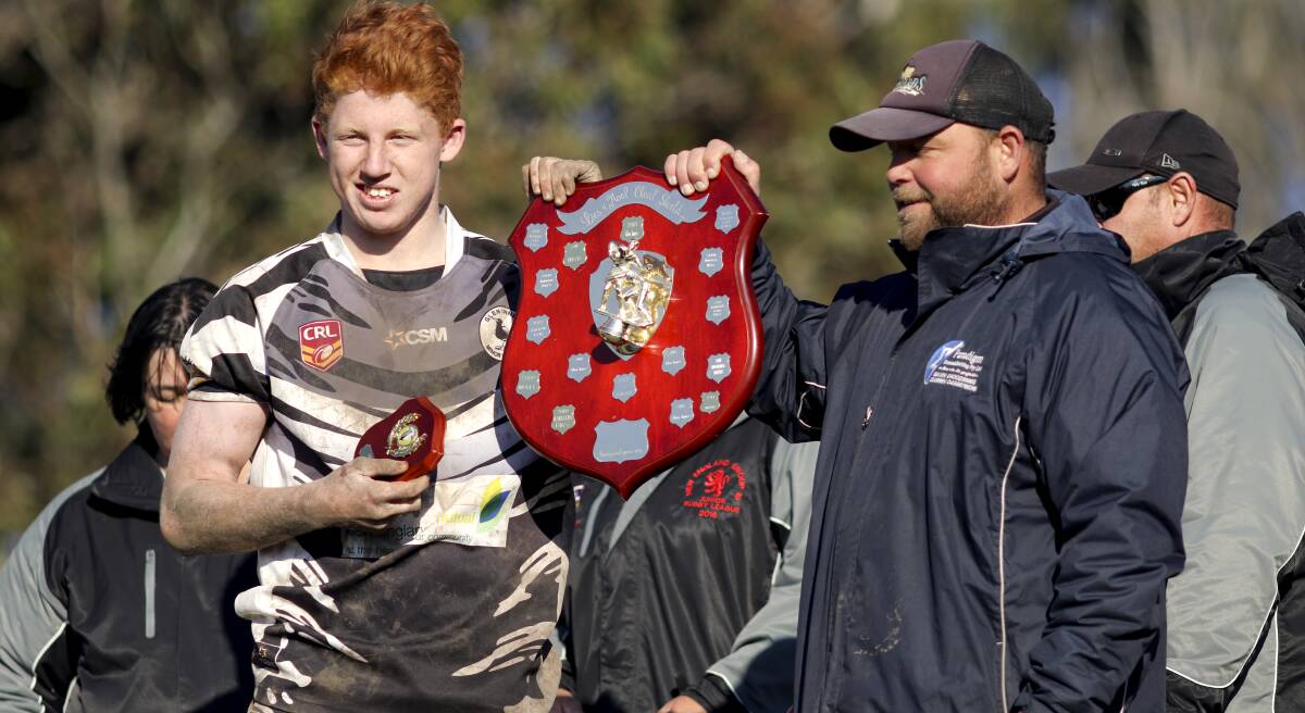 VICTORY: Glen Innes Magpies U-16 captain Alex Fisher holds up the 2016 premiership shield with coach Gavin Peterson 