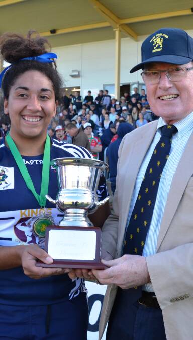 PREMIERSHIP CUP: Captain Amelia Tunamena with the cup and New England Rugby Union president David Clifton
