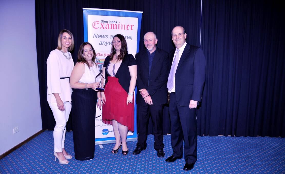 BUSINESS AWARD: 2015 Business of the Year StarLogixs electronics team with Hayley Lewis and Glen Innes Examiner manager Richard Quinn.
