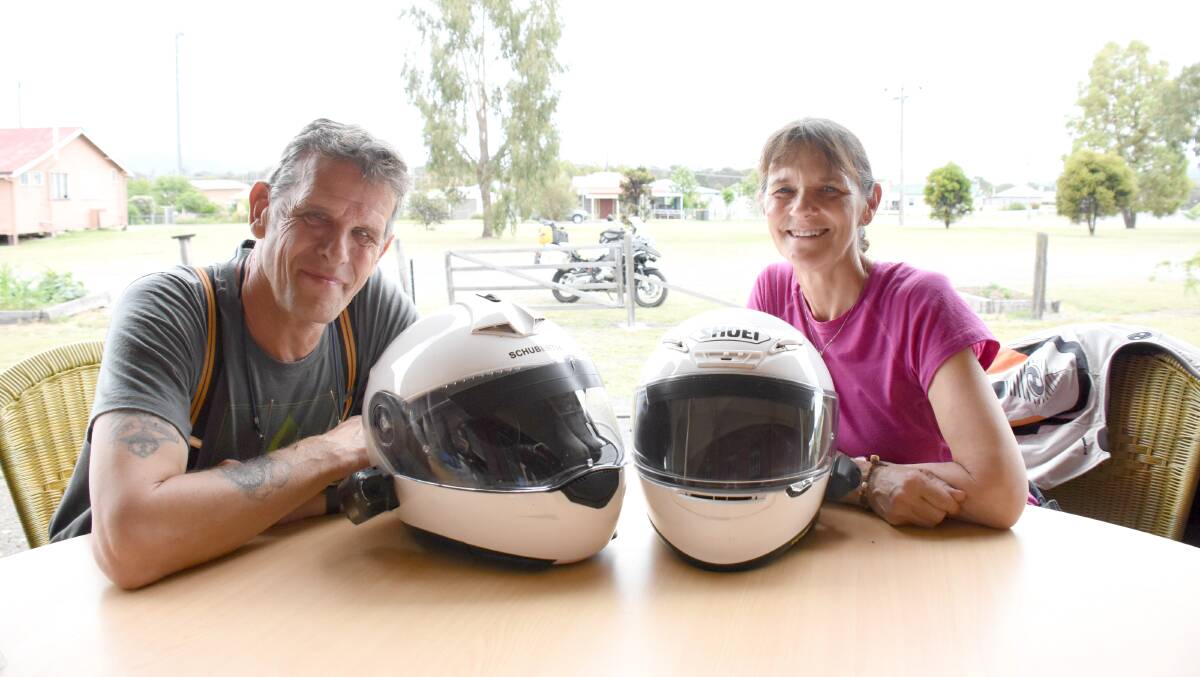 Jim and Jenny Mitchell at the Wallangarra Railway Station (with the trusty Bertie the motorbike in the background), one of the 'quirky' stopovers they've explored on their travels up the New England Highway.