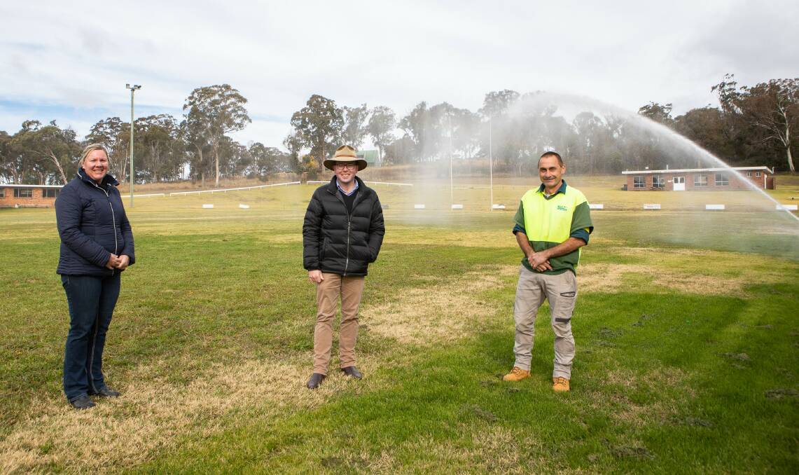 Glen Innes Minor League Club Secretary Linda Bruce, left, Northern Tablelands MP Adam Marshall and President Wayne Williams at Mead Park where the new irrigation system has been installed.