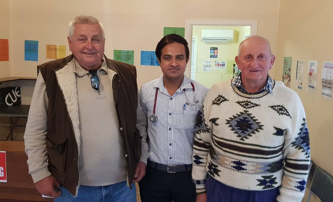 Deepwater residents Gerd Tucholski and Brian Barratt (pictured with Dr Dumi) have been helping to get the clinic operating again. 