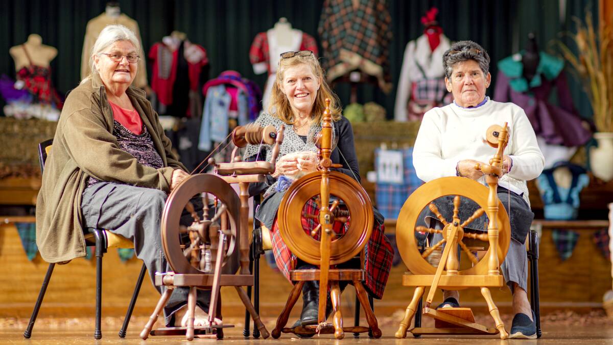 Spinning wheels: Sheena Horn, Susie Boyle and Val Sanders demonstrate traditional skills. Photo: Tony Grant.