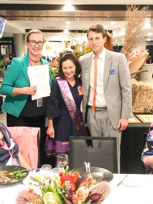Royal Agricultural Show councillor Alison Renwicke and Easter Show Fine Arts Committee chair Evan Hughes flank Mary Hollingworth, this year's Champion of the Show.