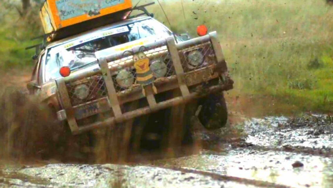 Nanna emerges from the mud on three wheels, during this year's Variety Bash.