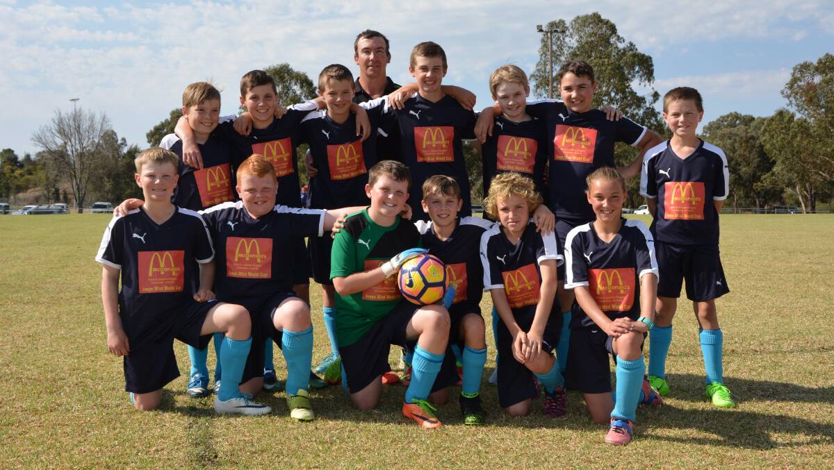 TRIUMPHANT: The Glen Innes under 12 soccer team who competed at the mini World Cup to win the Shield. Absent- Tom Walsh, Fin Leader.