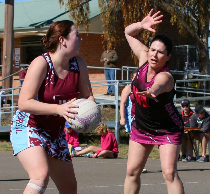 COMPETITIVE: Second division's Jane Lawrence defends an Inverell player in the first round of the Northern Inland Regional League on Sunday. Photo: Lynverell Photography. 