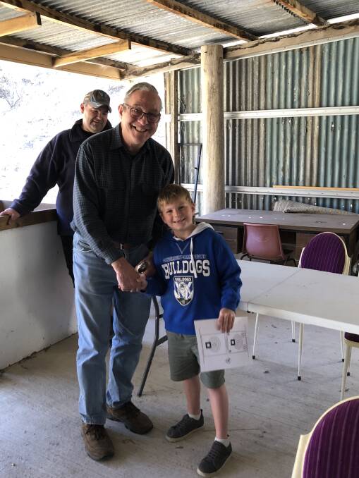 John Harrison receives a trophy for his accuracy at the interclub shoot. 