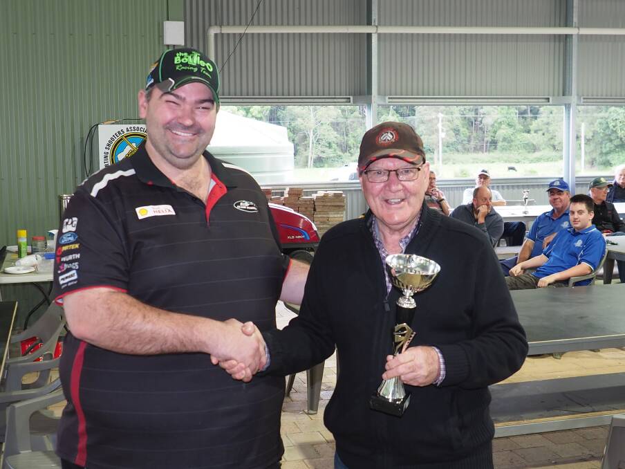 AUSSIE SELECTION: Glen Innes shooter Nick Ward receiving the trophy from Rod Madeley for his first place on the final day of Australian qualifyers. Photo: Ian Thompson. 