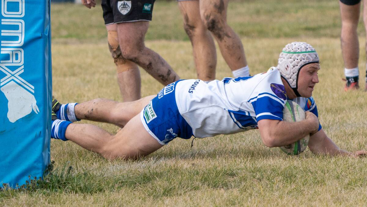 TRY TIME: Mitch Cook dives over for a five-pointer. Photo: Andrew Hoggan