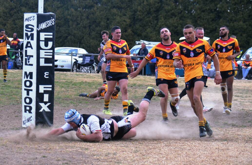 Jamie Watts crosses for the first of his four tries in the grand final. 