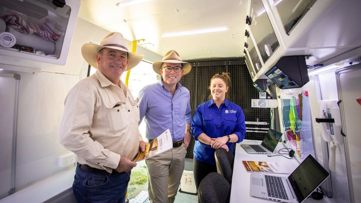 Uralla farmer Tim Bower with Northern Tablelands MP Adam Marshall and NSW Rural Assistance Authority staff member Victoria Blinkhorn at the launch yesterday.