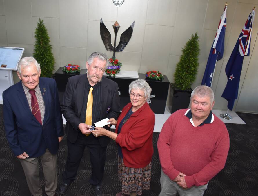Torchbearers president Sandra McBain receives $1000 donation from services club president John Urquhart, with legacy chairman Phil Perkins (left) and Pat Lonergan (right). 