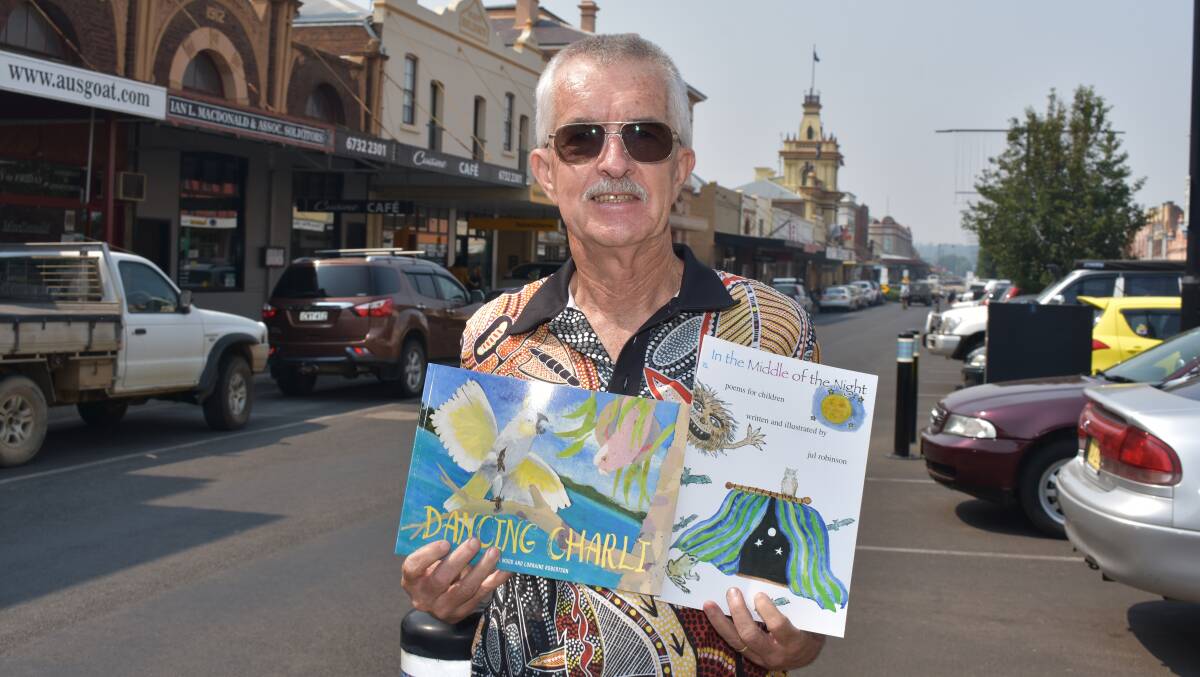 READING: Neil Griffith of Books4Outback visited Glen Innes Monday to deliver over 100 books for the Wytaliba and Red Range schools. Picture: Andrew Messenger. 