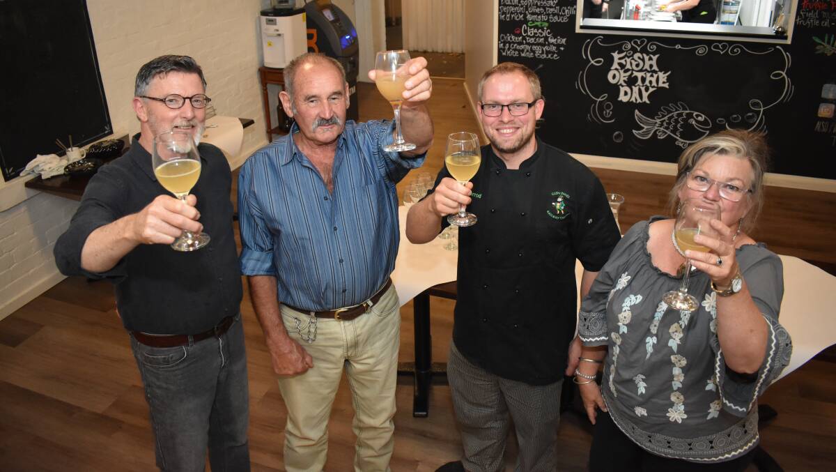 RAISING A GLASS: Torrington's Two Wild Souls Pierre and Glenice Armand (second from left and last on right) raise a glass of mead to a new business. Picture: Andrew Messenger. 