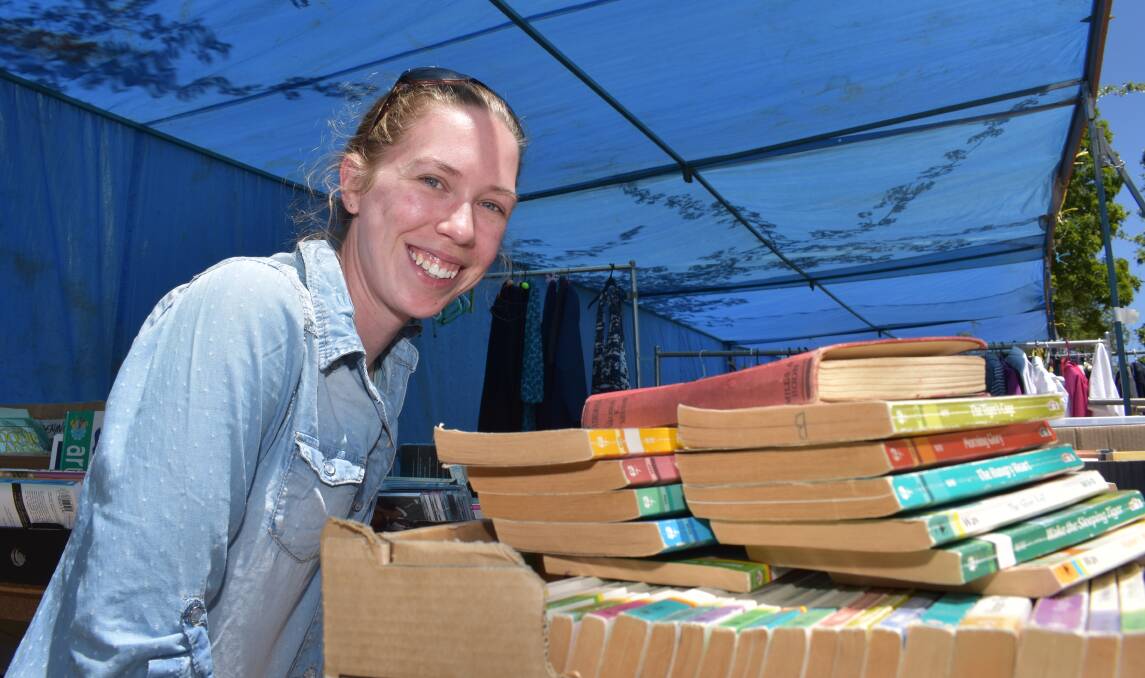 PRE-LOVED: Emily Speed shows off her stall of pre-loved books at the Holy Trinity Anglican church fete on Saturday. Pictures: Andrew Messenger. 