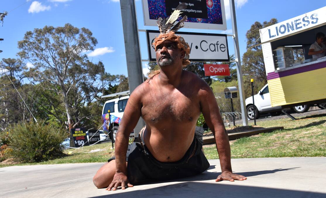Bob Blair performs a traditional Indigenous dance outside Gawura gallery in Glen Innes. 