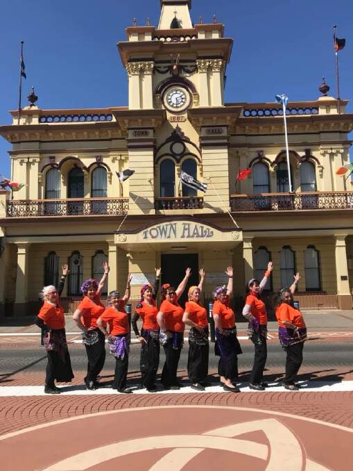 Glen Innes' bell dance community wearing the distinctive orange Shimmy Mob EASA shirts participated in the international campaign against domestic violence. 