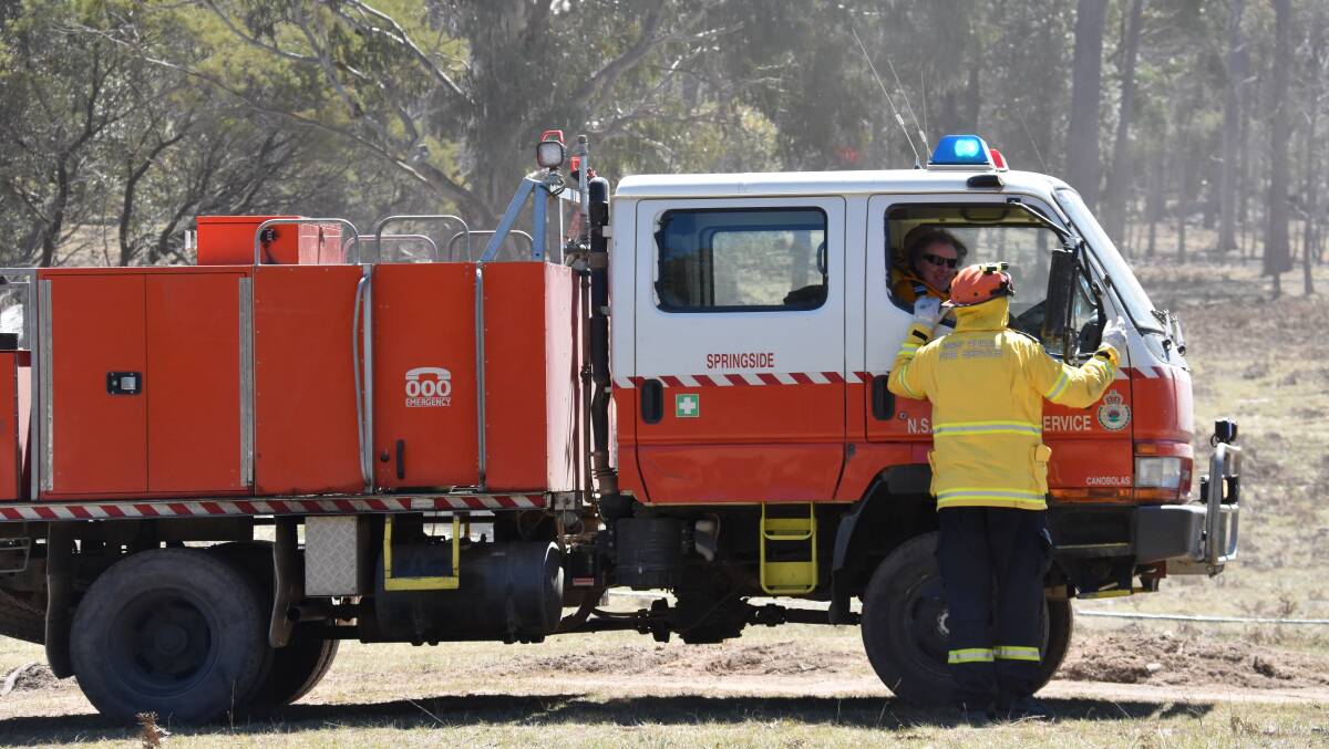 Local firefighting crews have downed tools after weeks battling bush fires across the New England.