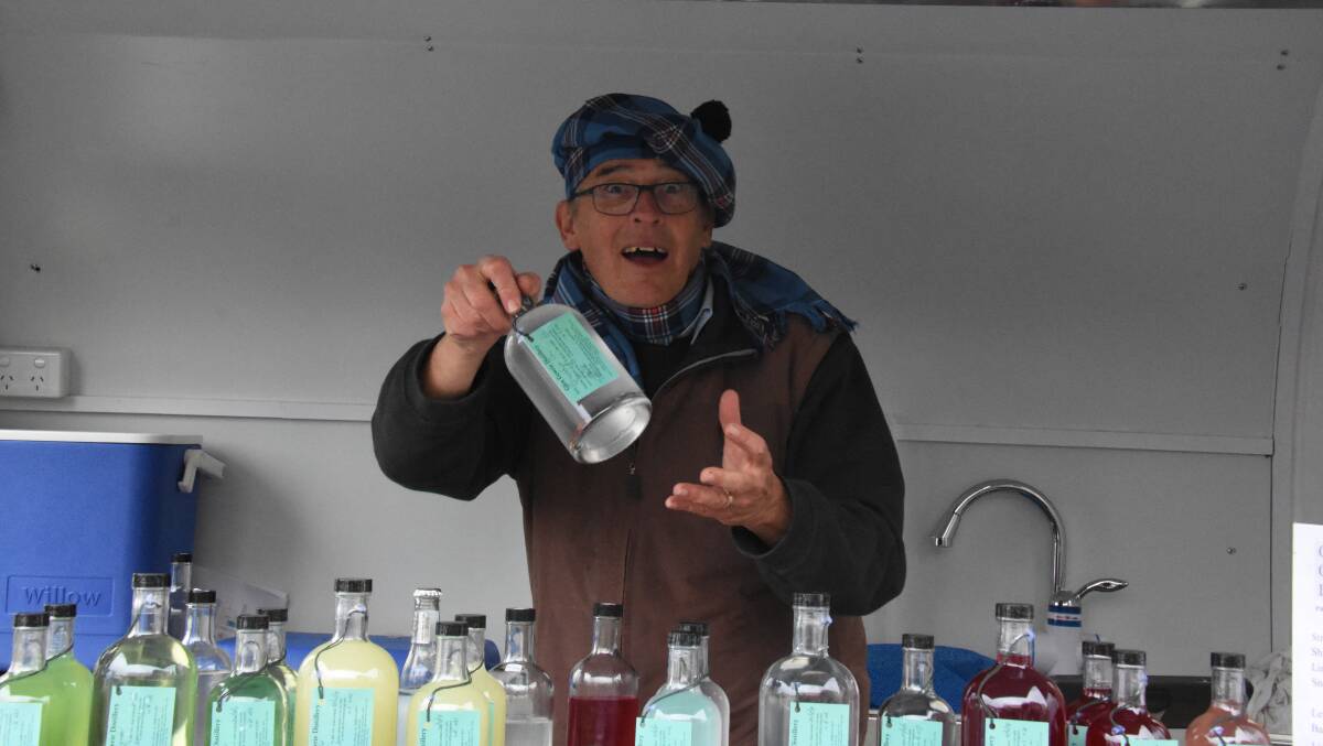 WEBMASTER: David Scott sells a bottle of Glen Gowrie gin at last year's Rugged Bash. The gin-maker is also the secretary of Business in Glen.