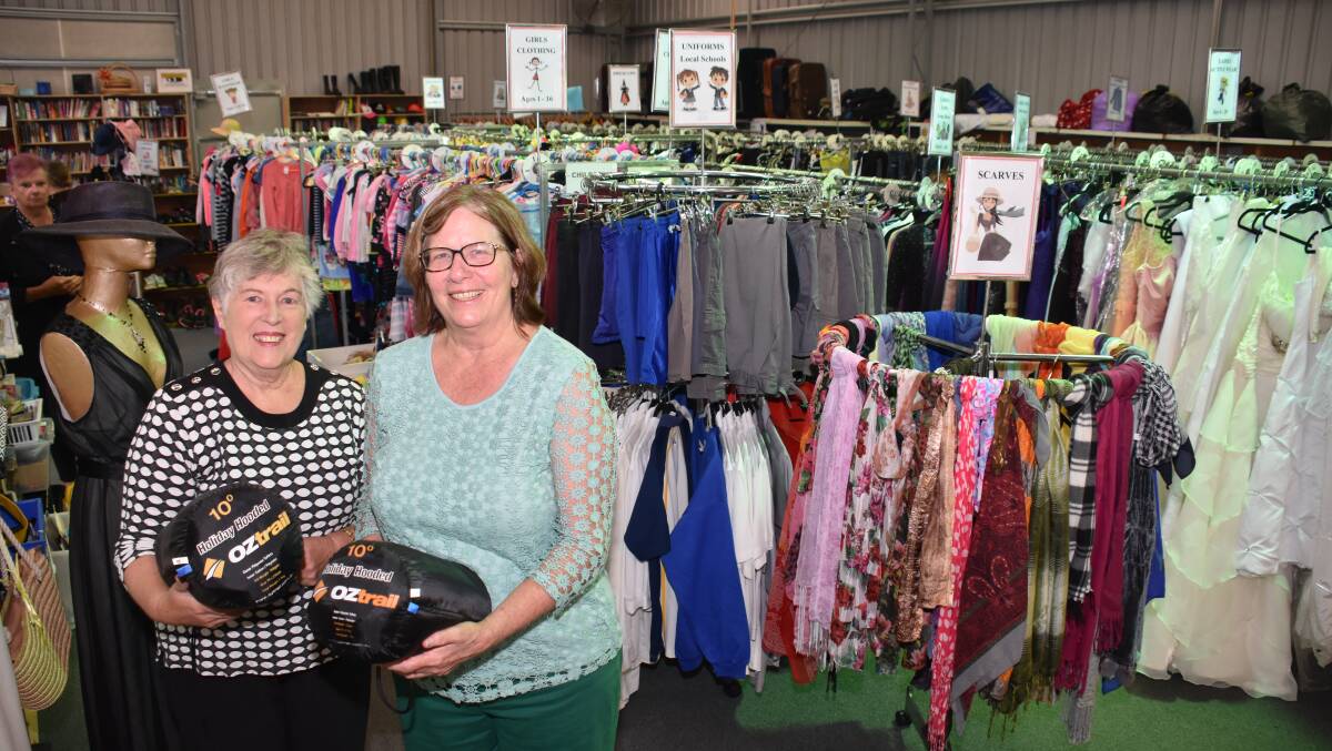 Joy Woods and Debra Marshall at the Glen Innes Opportunity Shop. The Op shop has earned big bucks selling donated RFS linen - and the money all goes back to the community.