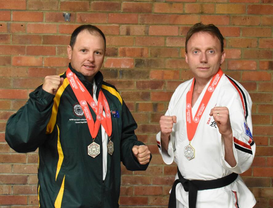 Chris Cooper and Nigel King won bronze and gold medals in Japan at the Super Karate-do World Grand Prix at Okinawa.