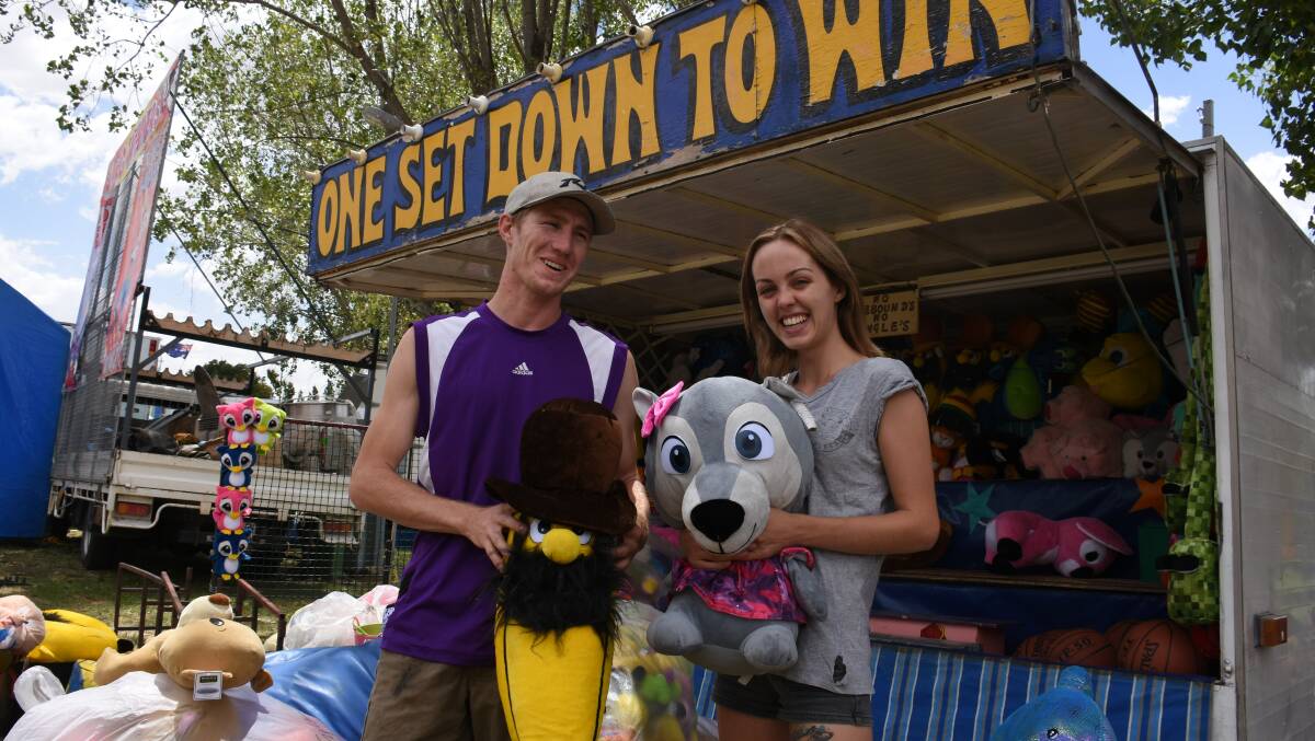 Cooper Nilon and Caitlin Grigg are all set and ready for the show after setting up in sideshow alley. Picture: Andrew Messenger
