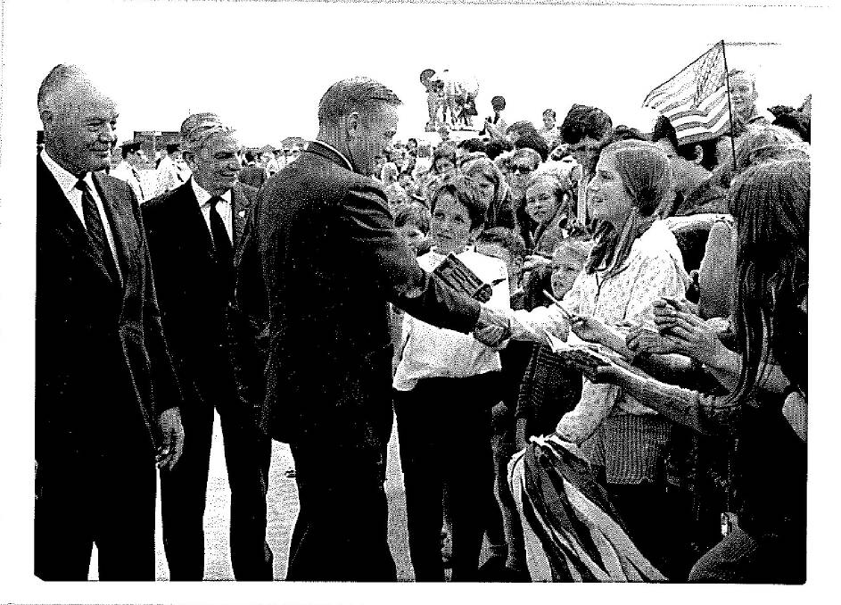 THEN: A 12 year old Jennifer Taylor welcomes astronaut Neil Armstrong at Sydney airport. Photo: Sydney Morning Herald, 1969.