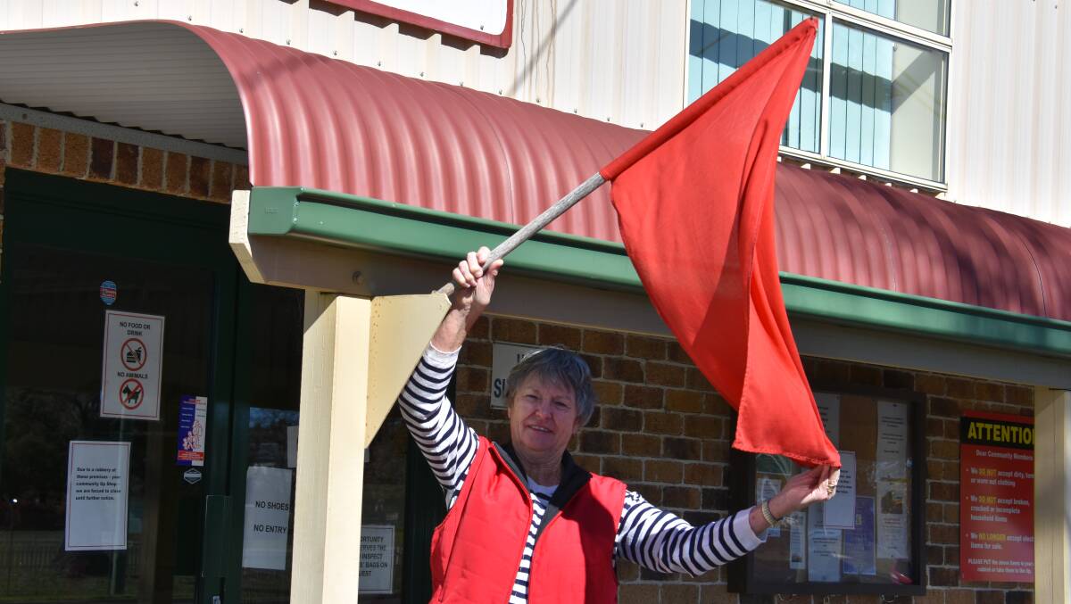 Opportunity Shop staff fly a red flag out the front of the store, which is on Lang street. 