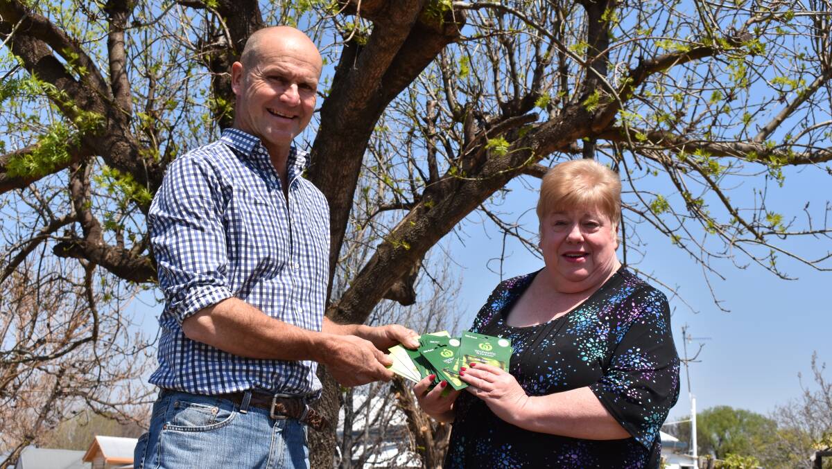 HELPING HAND: Stuart Brummell accepting a $2000 check from Quota president Kerrie Sturtridge. Picture: Andrew Messenger. 