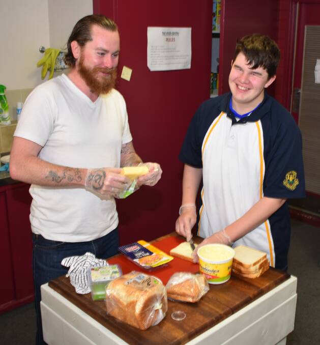 Liam Gabriel and Adam Jolly make cheese toasties at the Glen Innes youth centre. Picture: Andrew Messenger. 
