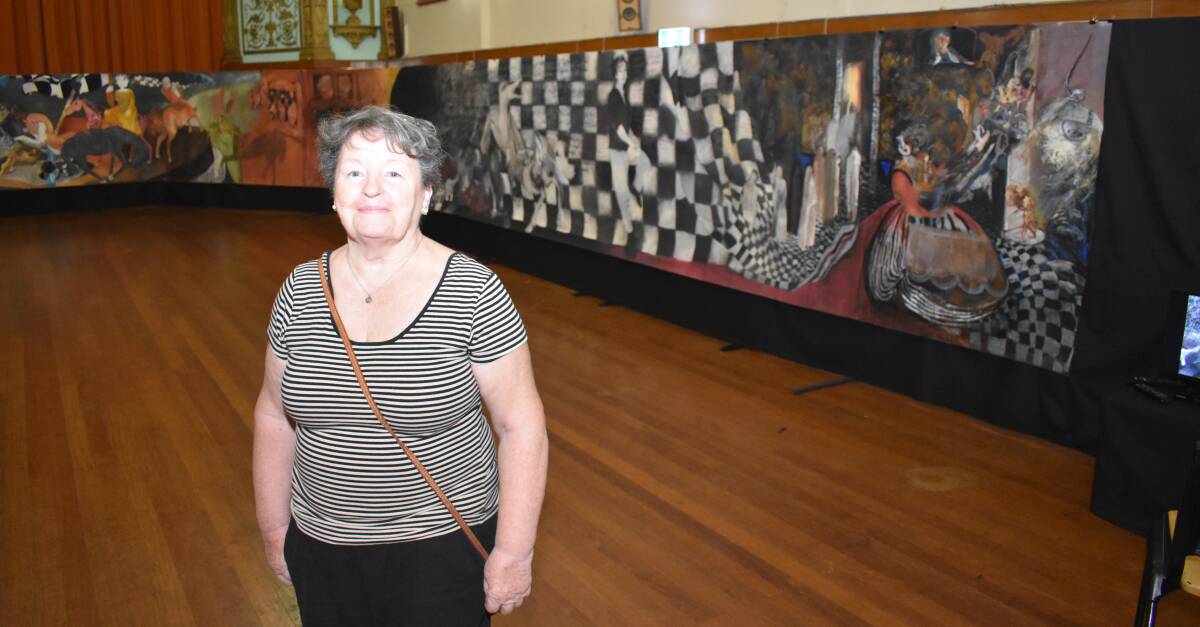 BIG ART: Margaret Haselwood shows off a small part of the vast painting. It took two years to complete. Pictures: Andrew Messenger.