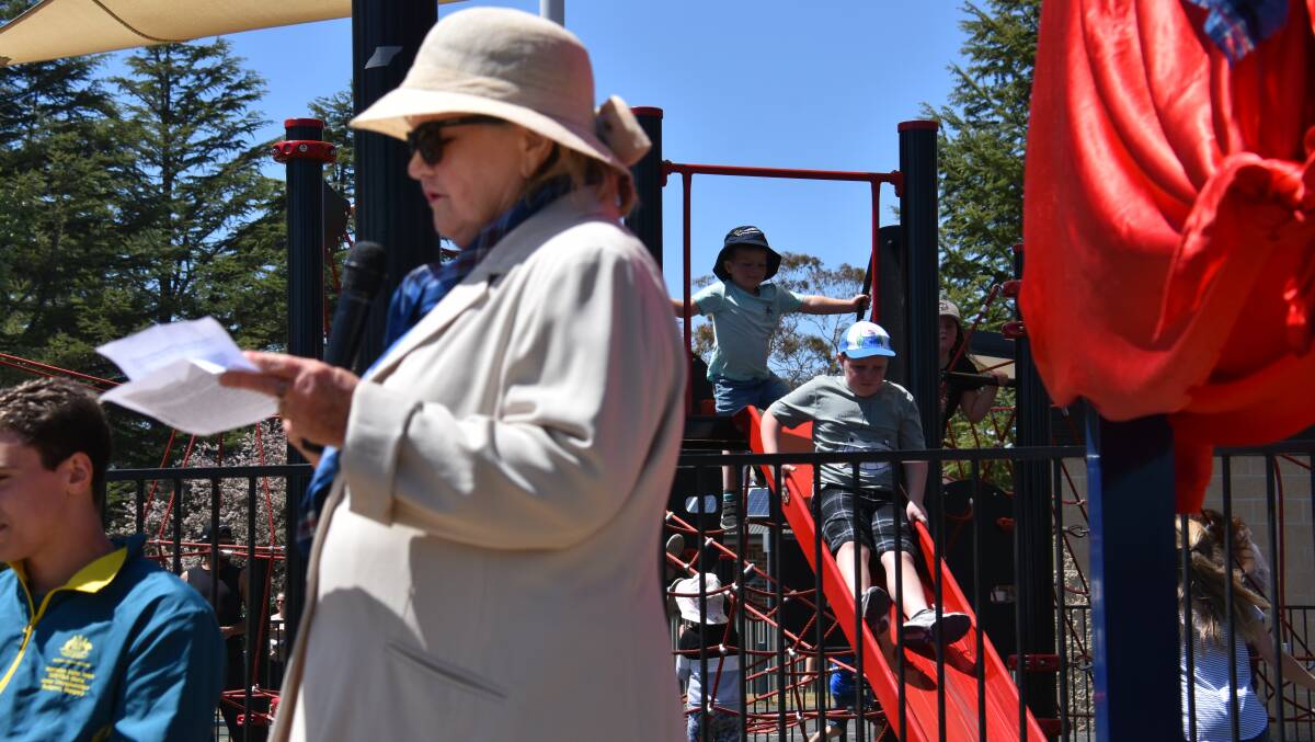 PLAYTIME: Mayor Carol Sparks says she hopes residents enjoy the new park, as dozens of kids get good use out of the new equipment behind her. Pictures: Andrew Messenger. 
