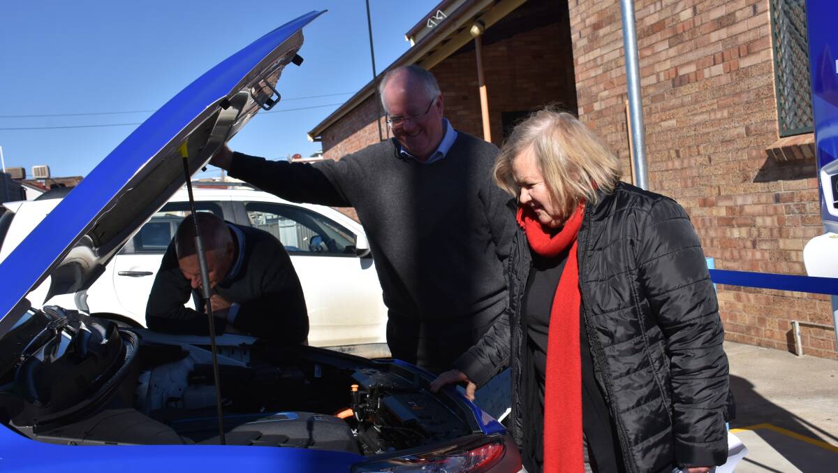 Council's leadership checks under the hood of NRMA's electric vehicle. 