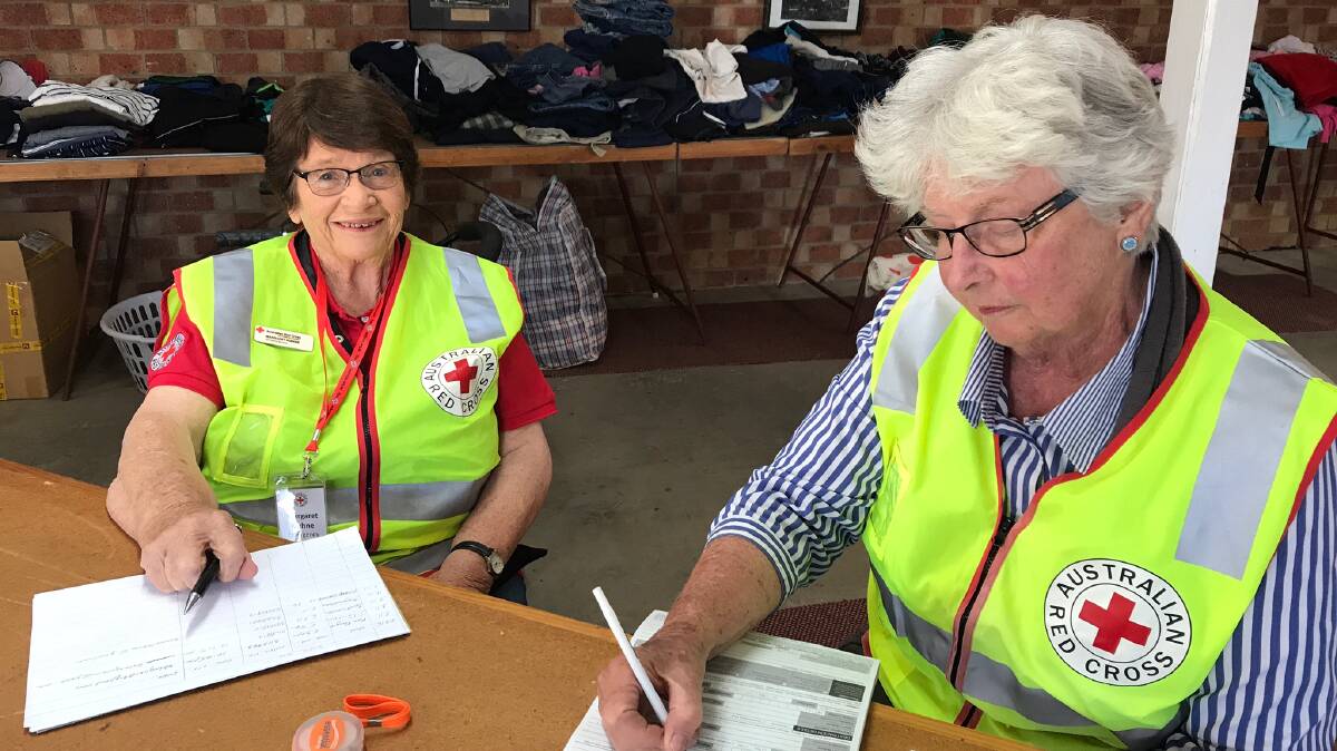 Red Cross volunteers helping at the Glen Innes evacuation centre. Salvation Army and Red Cross have been helping evacuees since Friday. 
