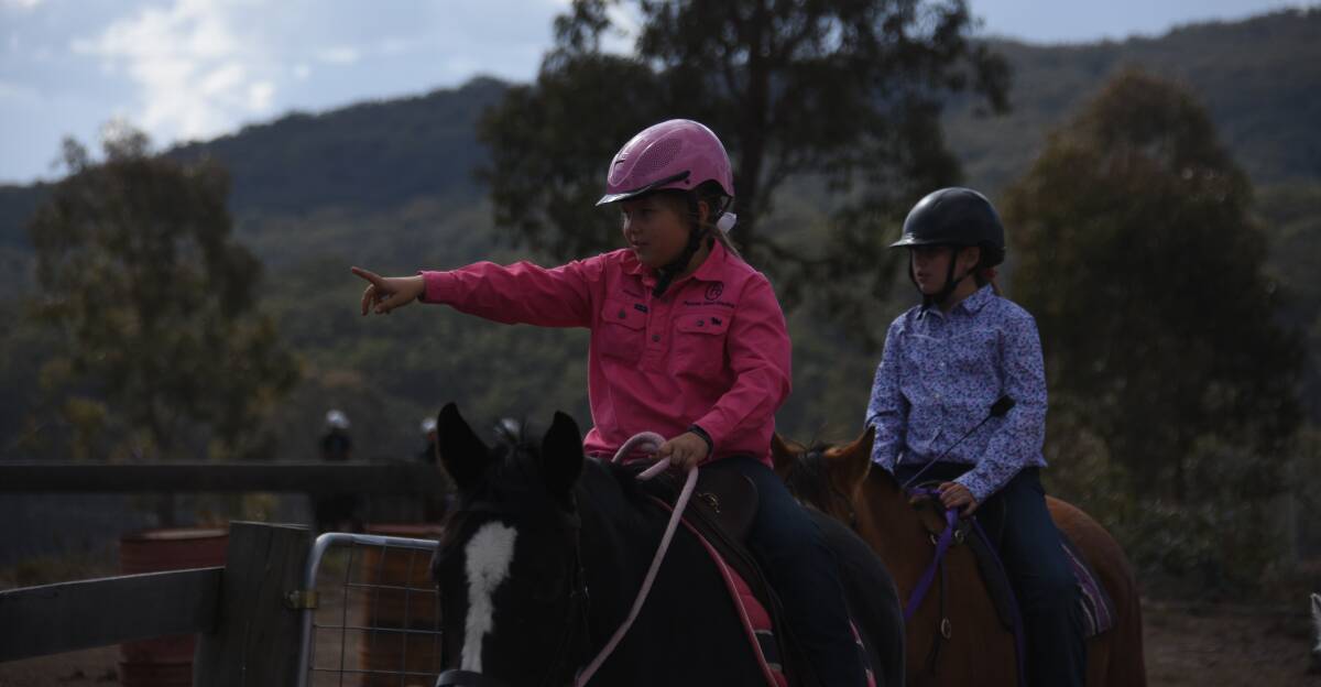 PONY CLUB: Allegra Pinfrey and Suzie Lockwood finish a long ride. The Glen Innes pony club has a large crop of young riders riding for the first time. 