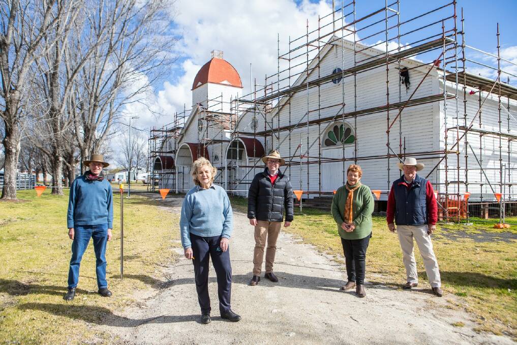 Glen Innes Showground Trustees John Lynne, Jo Cameron, MP Adam Marshall, Pauline Smith and Kae Klinger inspect progress on the old pavilion re-roofing thanks to funding from the from the Stronger Country Communities in 2020.