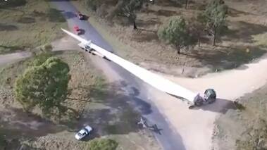 Drone footage of wind farm blade transport | video