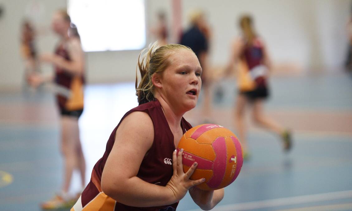 On the ball: Glen Innes netballer Annaleese Cameron practises her passing skills during the Northern Inland Academy of Sport's first regional training day for 2017. Photo: Gareth Gardner 120217GGB02