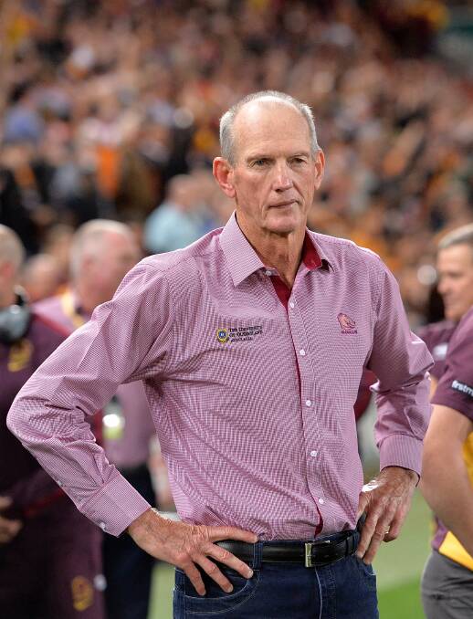 Coach Wayne Bennett watches on as his team celebrates victory after the NRL First Preliminary Final match between the Brisbane Broncos and the Sydney Roosters at Suncorp Stadium on September 25, 2015. (Photo by Bradley Kanaris/Getty Images)