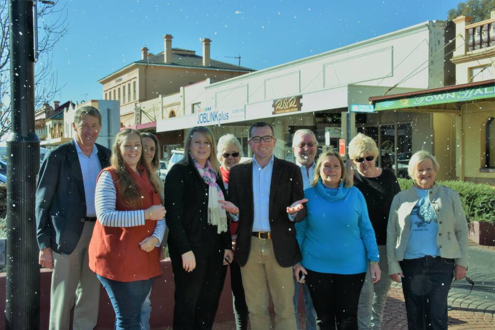 SNOW ON A SUNNY AFTERNOON: Mayor Cr Steve Toms, Business in Glen secretary Kylie Hawkins, and Northern Tablelands MP Adam Marshall with colleagues celebrating state funding for Chill N Glen. Photo: Nicholas Fuller.