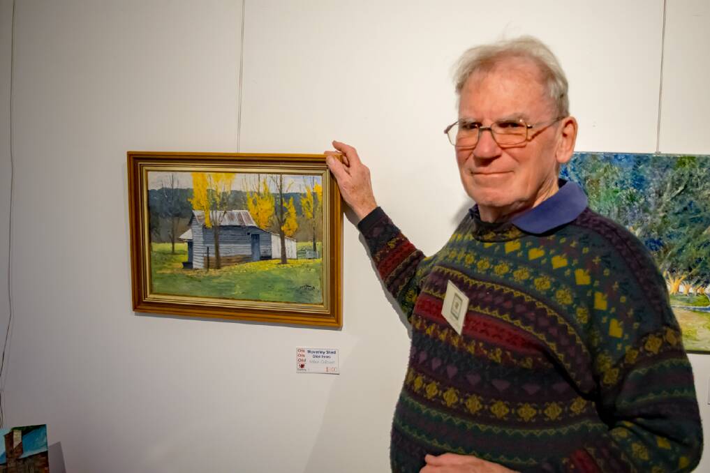 ARTIST: Local painter Mike Gilbert with one of the paintings at his new exhibition. Photo: William Redden