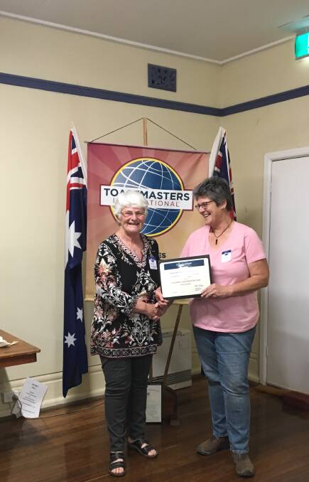 PUBLIC SPEAKING: Glen Innes Toastmasters president Gail Stone presents an award to last year's president Tracey Lane. Photo supplied.