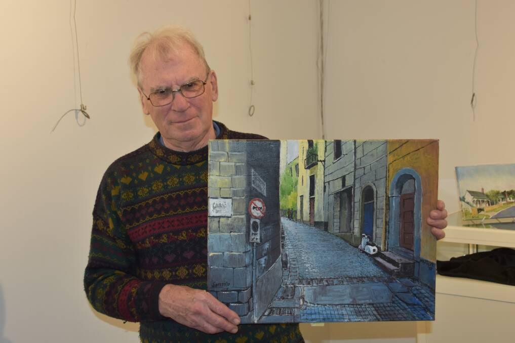 ARTIST: Mike Gilbert shows his painting of Sorrento, Italy, his favourite work in the "Oils, Oils, Oils!" exhibition. Photo: Nicholas Fuller